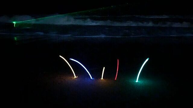 Glow_sticks_on_Baga_beach_at_night